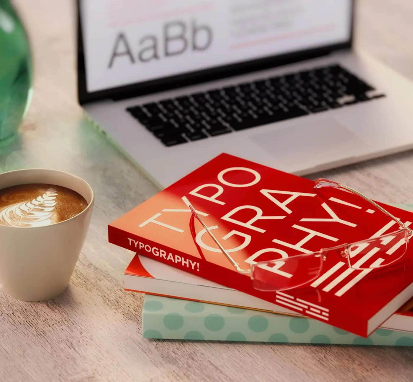 typography books and tools on desk for print design