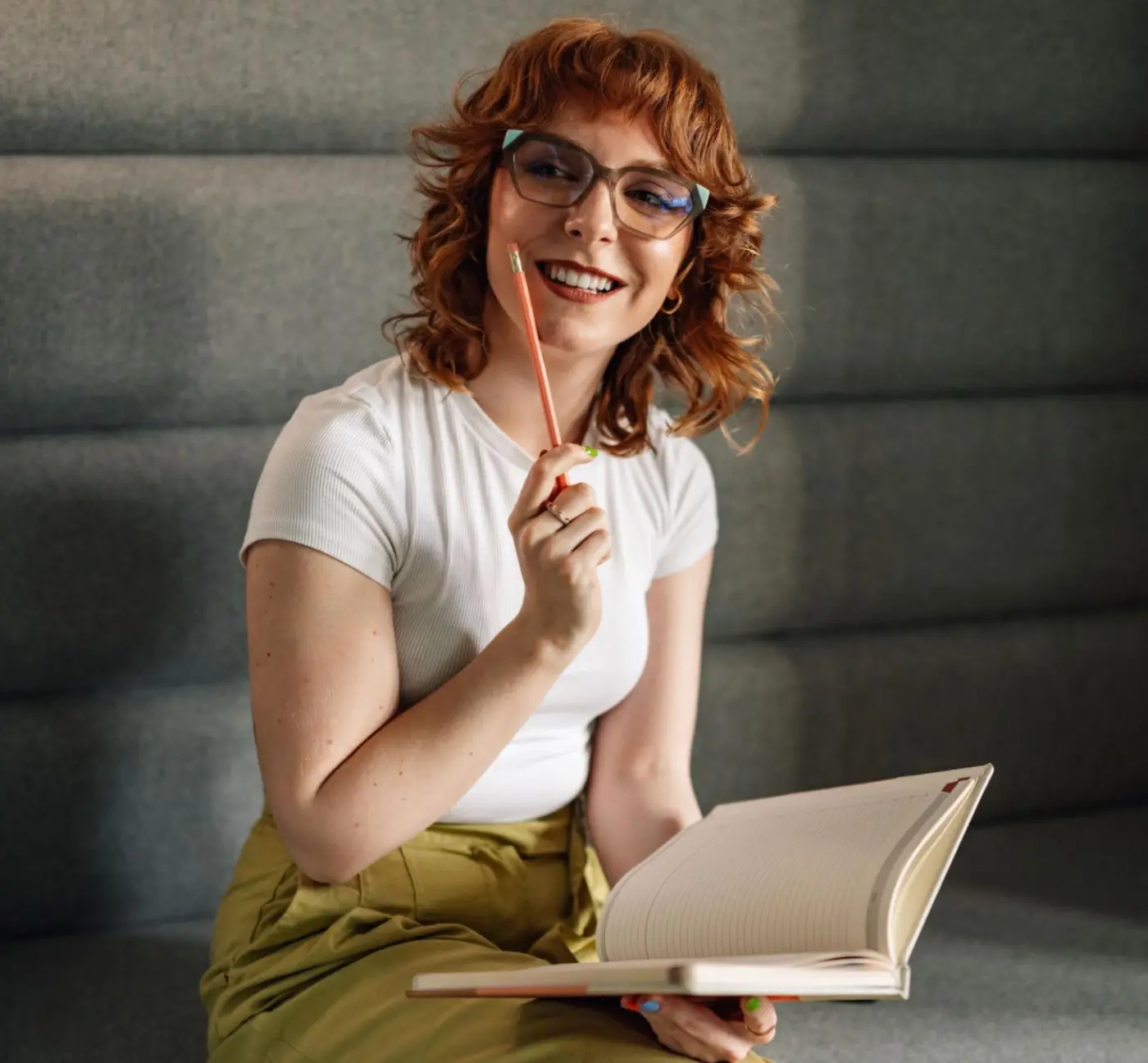 writer thinking while holding pencil and notebook