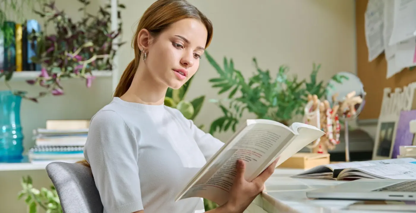 children’s book editor reviewing manuscript at desk